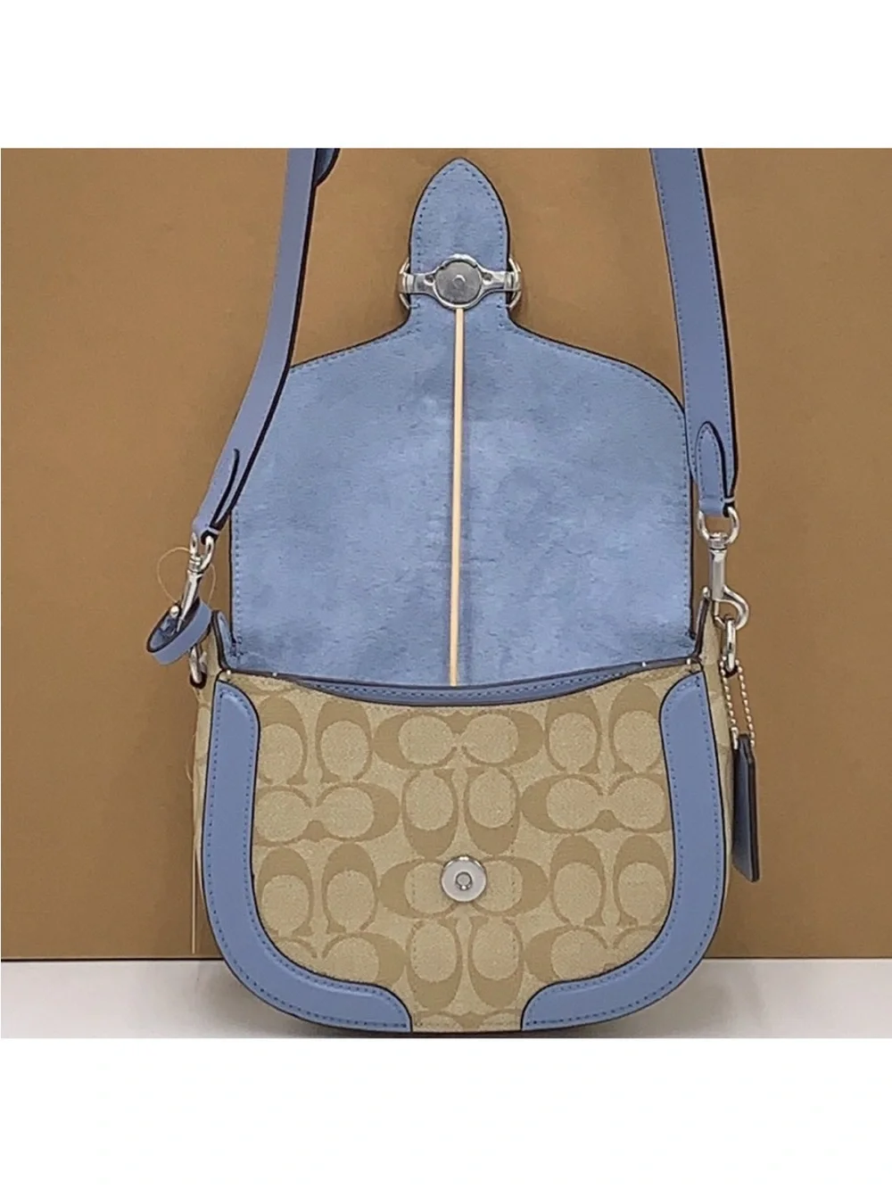 COACH Georgie Saddle Bag In Signat Canvas COLOR:
Silver/Light Khaki/Marble
Blue - Picture 11 of 16